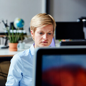 woman looking at computer