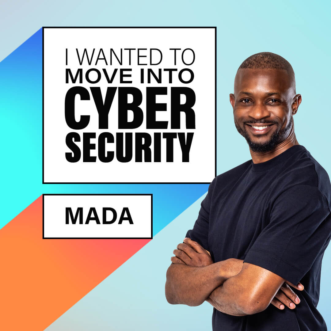 Young black male smiling with arms crossed. He is bald and wearing a dark t-shirt. Cyber security course.